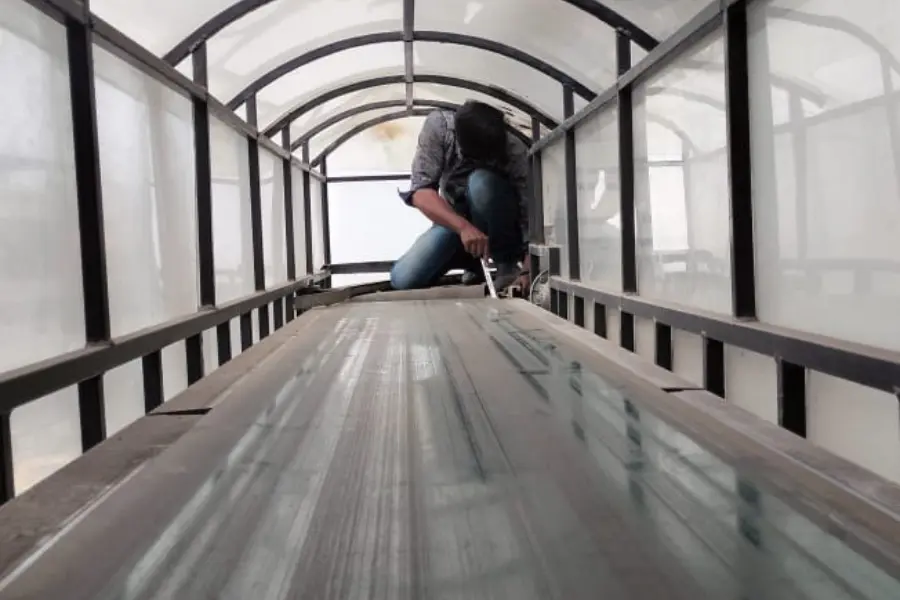 Emergency belt conveyor repair service in a manufacturing plant.